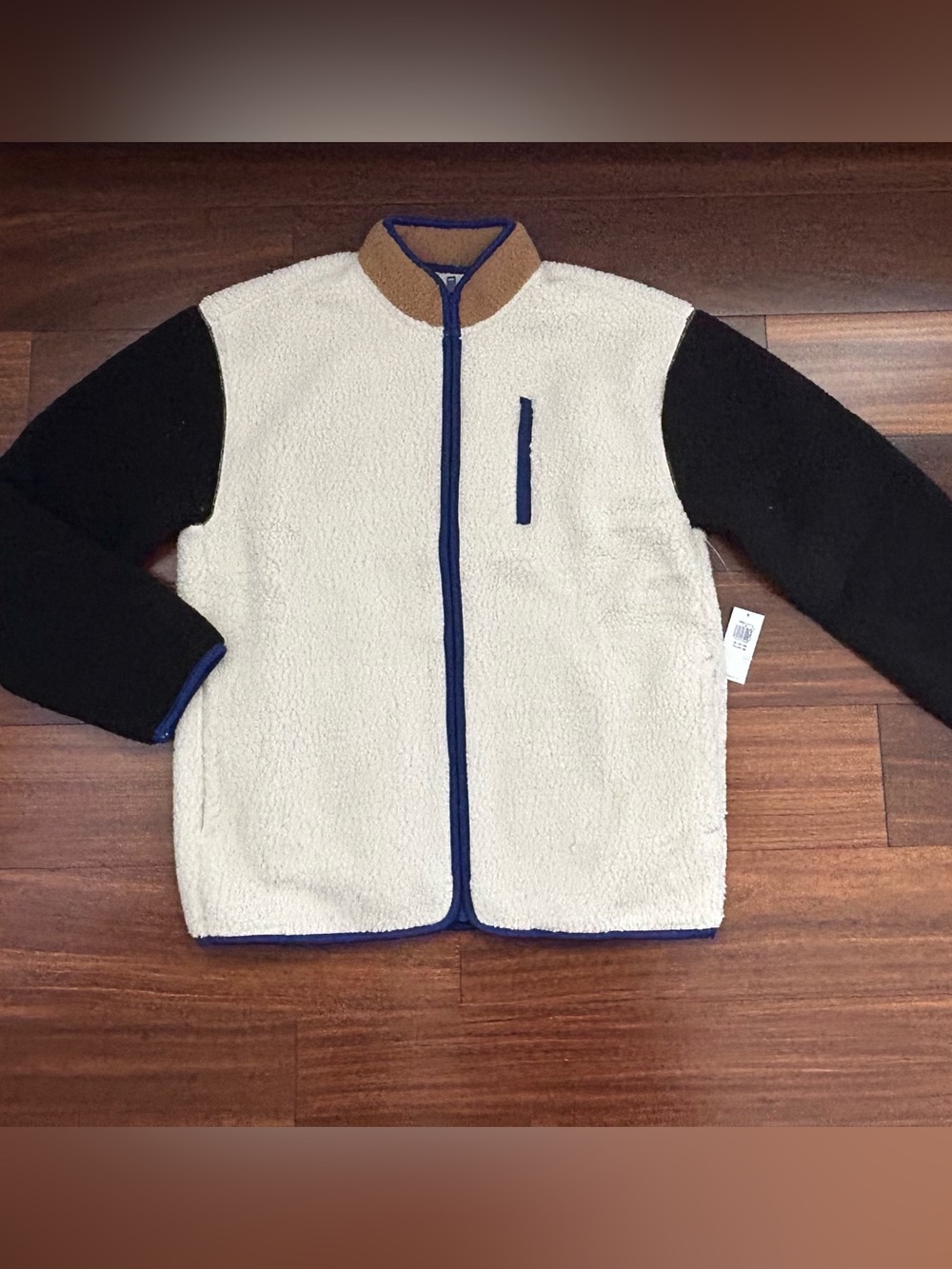 Old Navy Cream Sherpa Jacket with Black Sleeves and Blue Trim